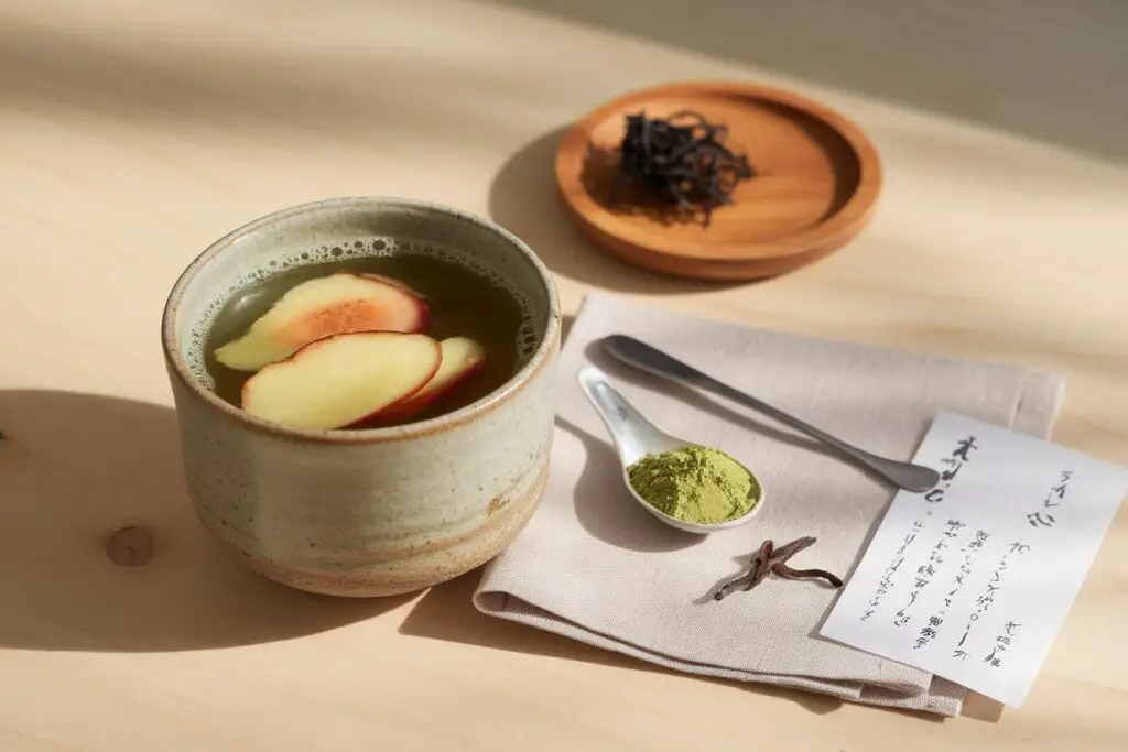 Japanese Mounjaro recipe detox drink made with matcha, ginger, kombu, and umeboshi plum in a ceramic cup