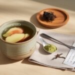 Japanese Mounjaro recipe detox drink made with matcha, ginger, kombu, and umeboshi plum in a ceramic cup