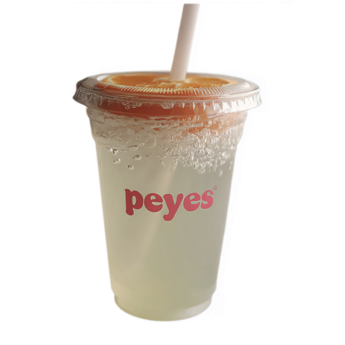 Popeyes Pickle Lemonade in original branded cup with straw and lemon slice