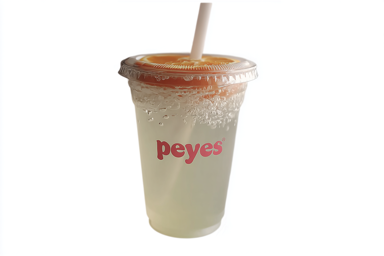 Popeyes Pickle Lemonade recipe in original branded cup with straw and lemon slice